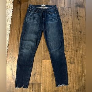 PAIGE Blue Skinny Jeans with Tapered Leg and Subtle Fading Raw Hem
